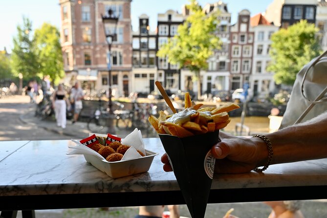10 Tastes of Amsterdam: Food Tour by UNESCO Canals and Jordaan - Jordaan, poffertjes, and a local drink
