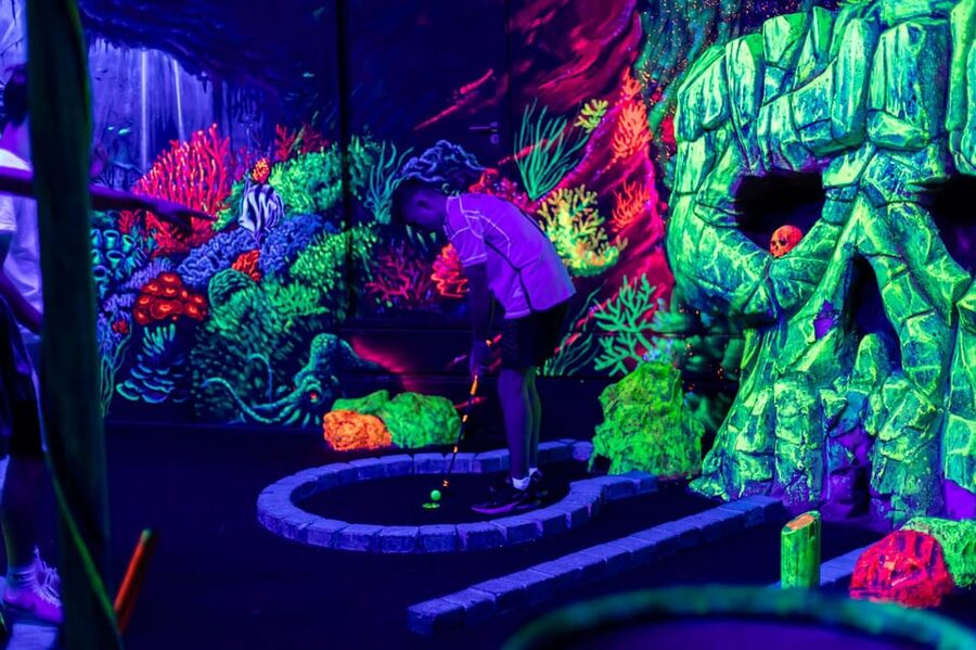 Aloha Amsterdam: 12-Hole Glow-in-the-Dark Mini-Golf - From the entrance to the first pirate hole
