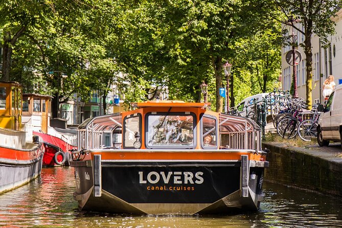 Amsterdam 1h Canal Cruise by Semi-Open Boat with Audio Guide - Merchant houses and the canal belt