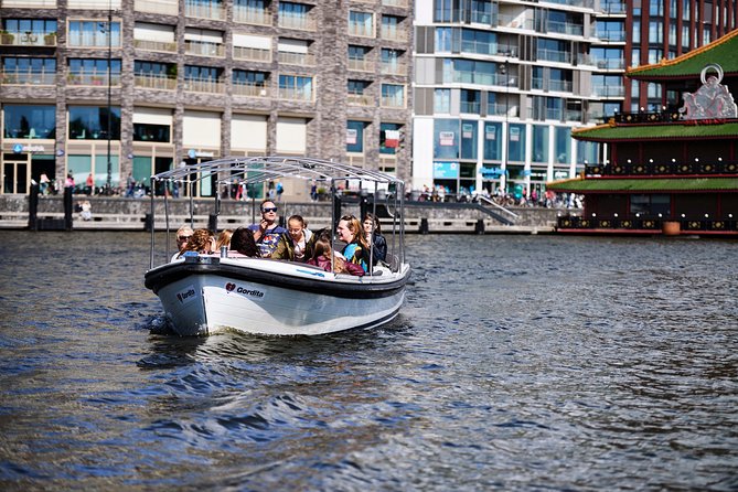 Amsterdam: 60-Minute Guided Private Canal Cruise with Drinks - Drinks, snacks, and comfort on board