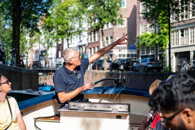 Amsterdam: 75 minute Open Boat Canal Cruise with Live Guide - From Leidseplein to the city’s grand canal belt