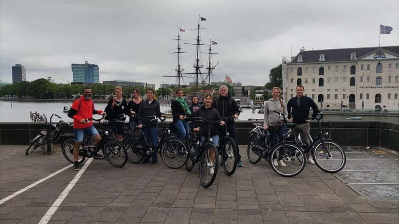 Amsterdam bike tour with a French-speaking guide local! - Dam Square, Westerkerk, and the canal belt