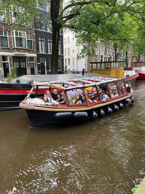 Amsterdam: Boat Tour with Optional Unlimited Drinks - The Enterprise boat, seating, and atmosphere
