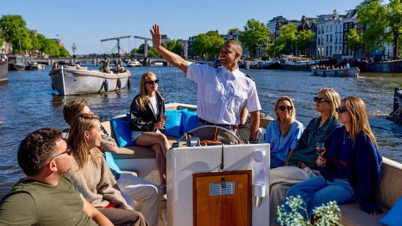 Amsterdam: Canal Cruise in Open Boat with Drink Option - Starting near Central Station or the Anne Frank House