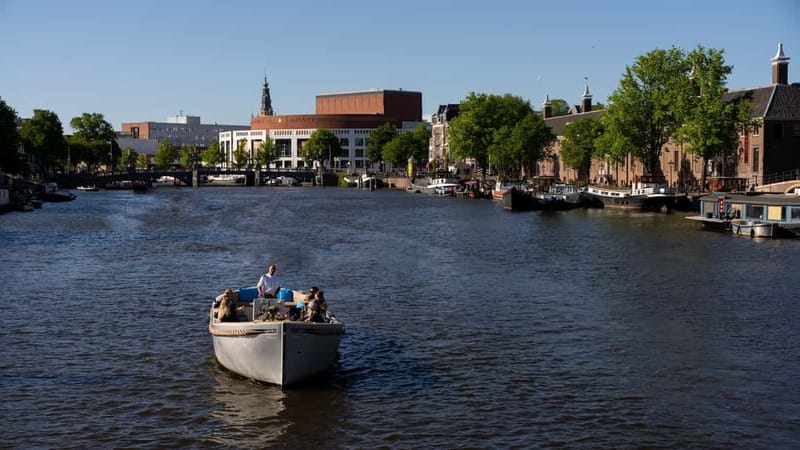Amsterdam: Canal Cruise in Open Boat with Drink Option - Royal Theater Carré and the Magere Brug