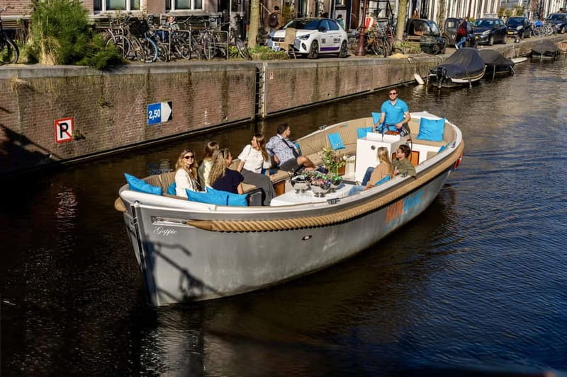 Amsterdam: Canal Cruise in Open Boat with Drink Option - Dancing Houses, Herengracht, and the Seven Bridges area