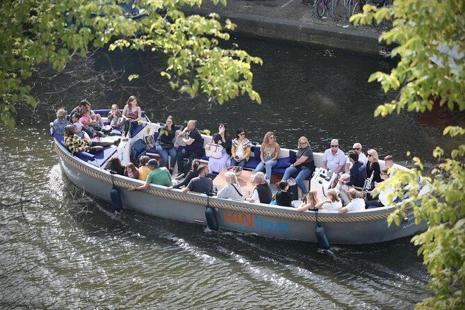 Amsterdam Canal Cruise in Open Boat with Unlimited Drinks Option - Amsterdam from the water, one bridge at a time