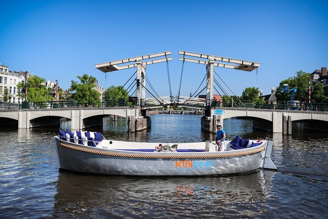 Amsterdam Canal Cruise in Open Boat with Unlimited Drinks Option - The glass-topped and open-air setup