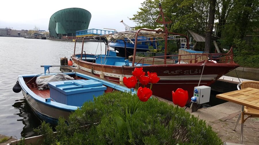 Amsterdam: Canal Cruise on a Wooden Refugee Boat - Meeting the guide and hearing a personal journey