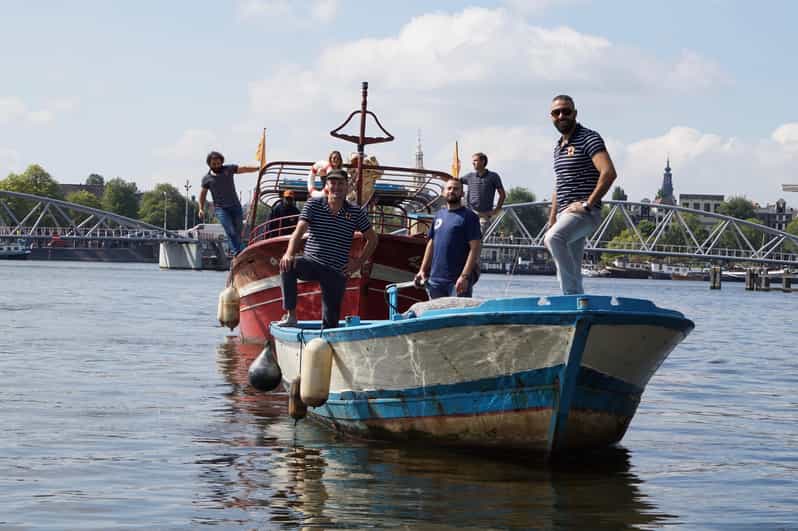 Amsterdam: Canal Cruise on a Wooden Refugee Boat - What happens during the 90-minute route