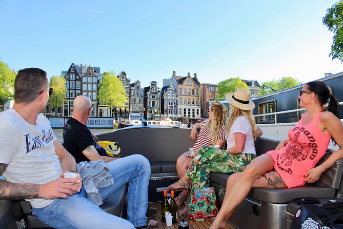 Amsterdam Canal Tour by Open Boat – 90 min Small Group Experience - Why a small open boat changes the Amsterdam canal ride