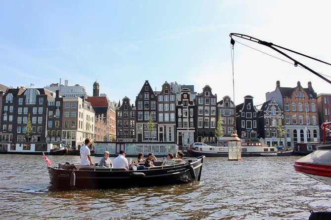 Amsterdam Canal Tour by Open Boat – 90 min Small Group Experience - De Wallen, the Oudezijds canals, and Amsterdam’s oldest church