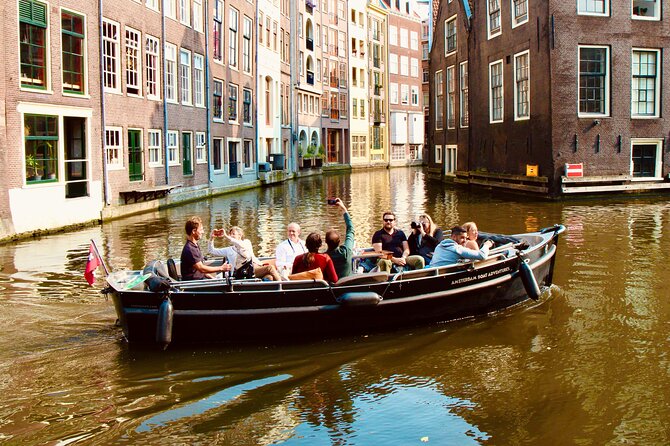Amsterdam Canal Tour by Open Boat – 90 min Small Group Experience - Small canals and a medieval defensive tower