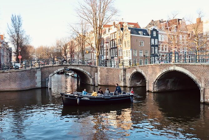 Amsterdam Canal Tour by Open Boat – 90 min Small Group Experience - Botanical Gardens, the Herengracht, and the Seven Bridges