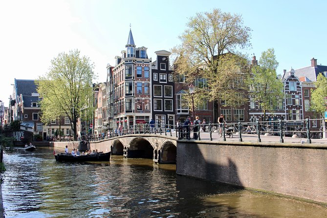 Amsterdam Canal Tour by Open Boat – 90 min Small Group Experience - Comfort, weather, and what to bring
