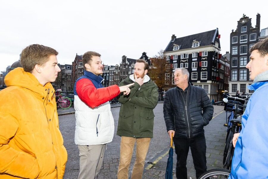 Amsterdam Central Walking Tour - Starting at Nieuwezijds Kolk and entering old Amsterdam