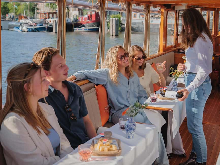 Amsterdam: Classic Boat Cruise with Optional Cheese & Wine - Boarding the covered electric boat