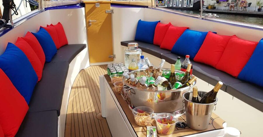 Amsterdam: Covered Canal Booze Cruise with Unlimited Drinks - From the Red Light District to Amsterdam Central