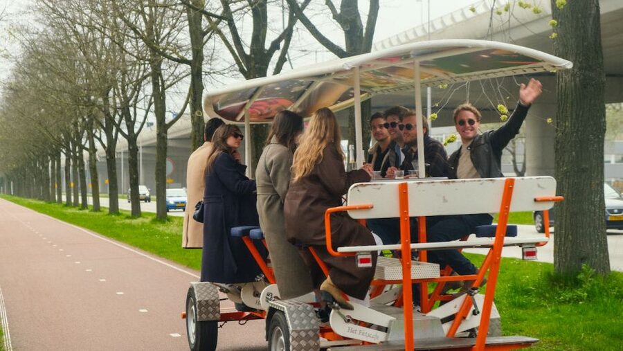 Amsterdam: Dutch Beer Bike Blast Tour with Onboard Bar - Music, weather cover, and the ride itself