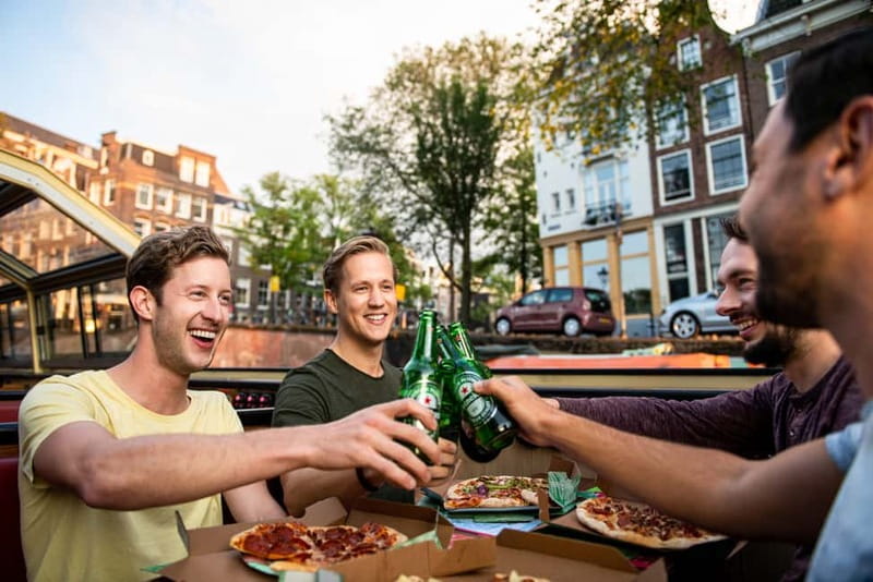 Amsterdam: Evening Pizza Cruise Along the Canals - Settling into the heated boat