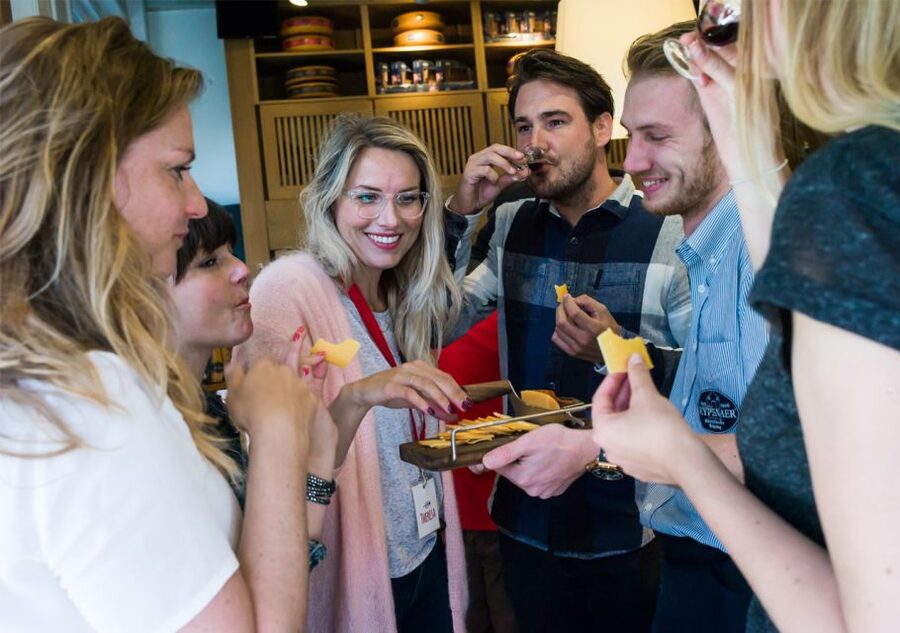 Amsterdam: Guided Cultural Food Tour in German or English - Magna Plaza adds a quick architectural pause