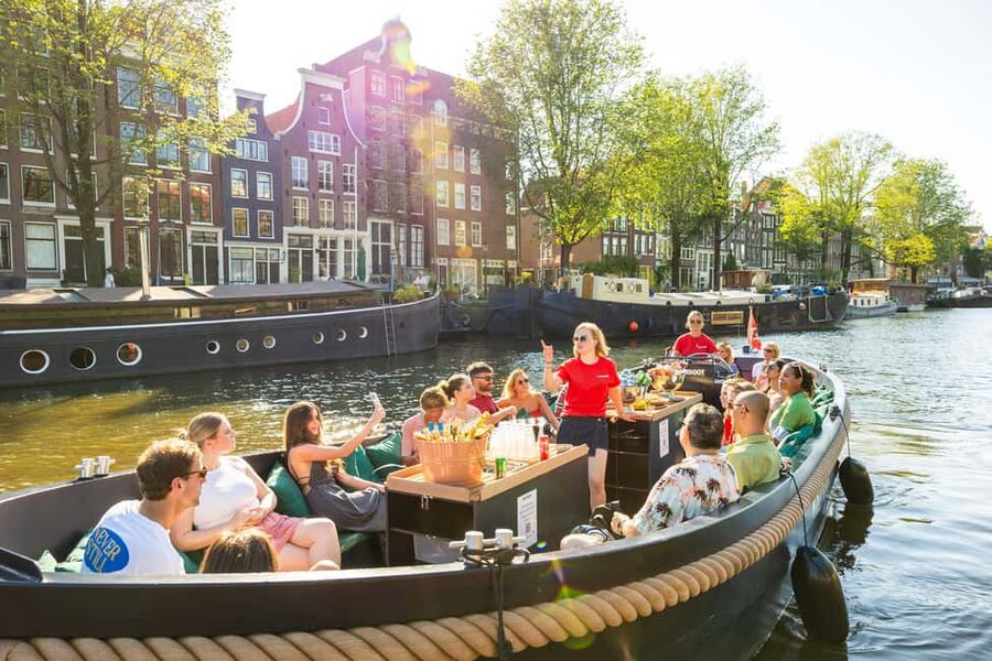 Amsterdam: Guided Open Boat Canal Cruise Including Drink - Key points to know before booking