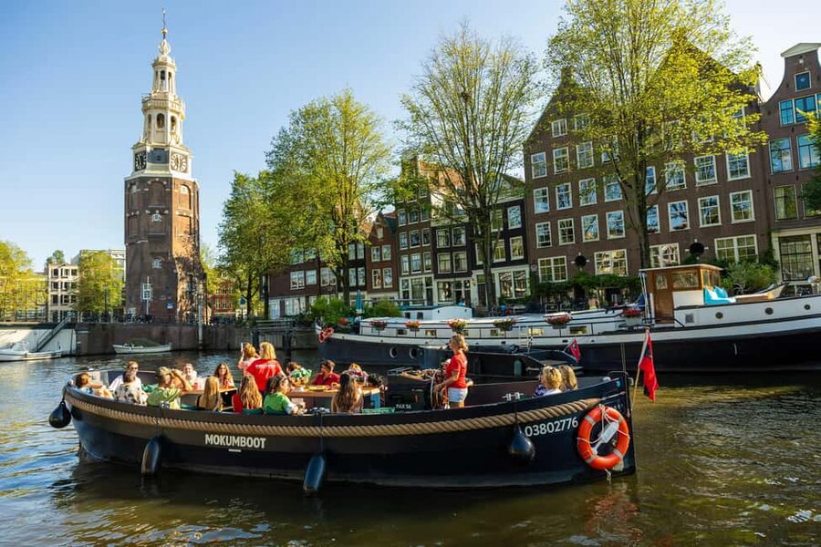 Amsterdam: Guided Open Boat Canal Cruise Including Drink - Old Amsterdam around the Jewish Cultural District and Waterlooplein