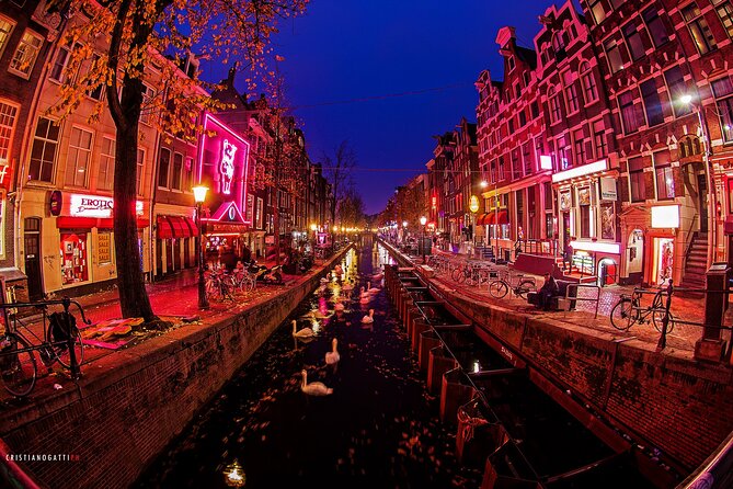 Amsterdam: Guided Red Light District and City Walking Tour - Dam Square and the city built on wooden poles