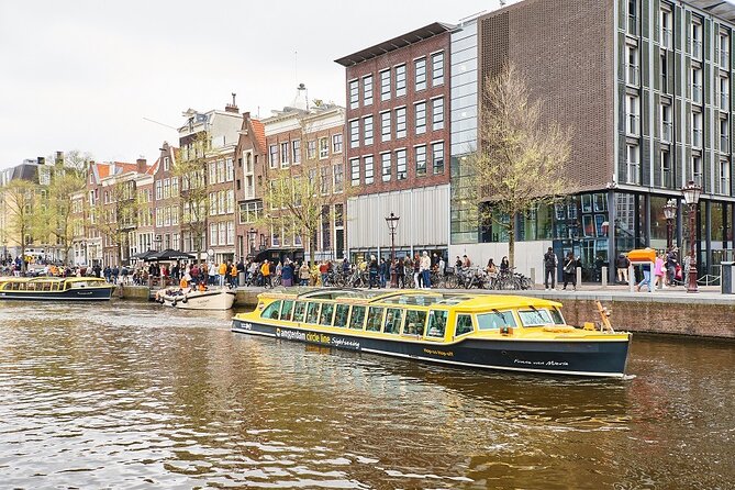 Amsterdam: Historic City Sightseeing Canal Cruise - Westerkerk, the Jordaan, and a houseboat interior