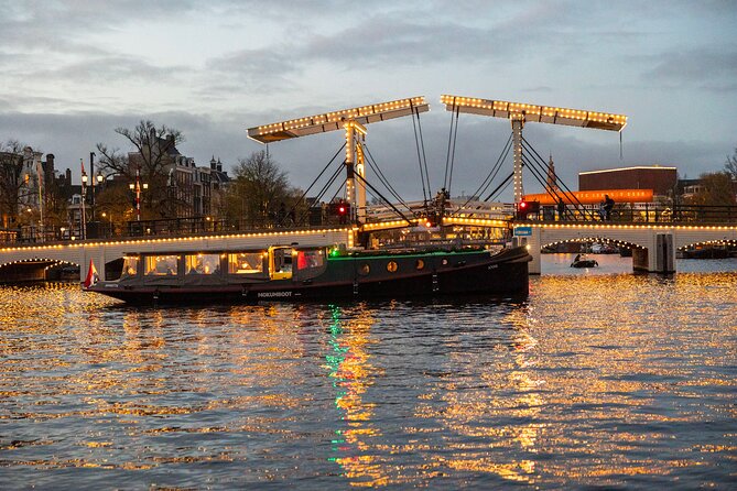 Amsterdam: Light Festival Open Boat - Unl. Drinks Option - Starting beside Pierre Cuypers’s Amsterdam landmarks