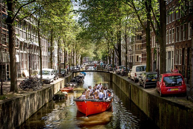 Amsterdam Light Festival: Saloon Boat Cruise + Hot Drinks & Bite - Weather, capacity, and comfort