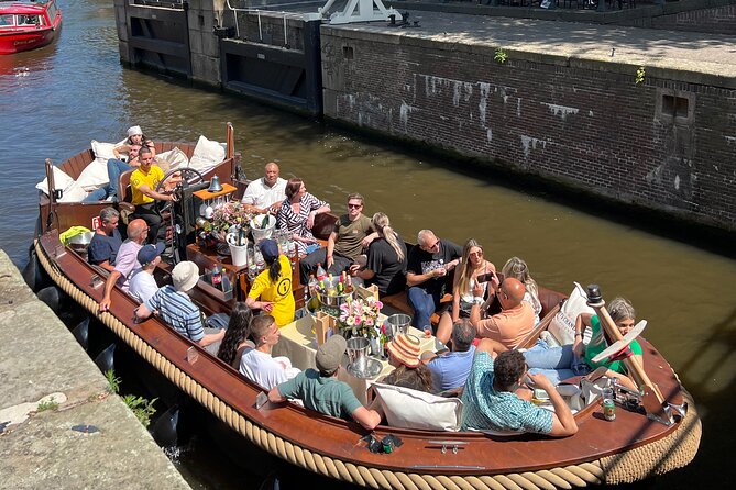Amsterdam Luxury Boutique Boat tour with Unlimited Beer and Wine - Oude Kerk and Amsterdam’s older layers
