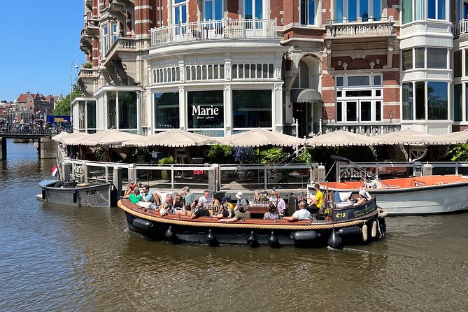 Amsterdam Luxury Boutique Boat tour with Unlimited Beer and Wine - Meeting the boat at Oudezijds Voorburgwal 226
