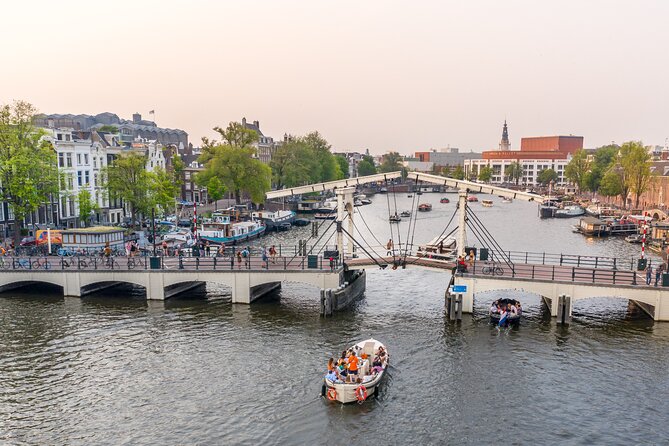 Canal boats and gabled houses along an Amsterdam canal
