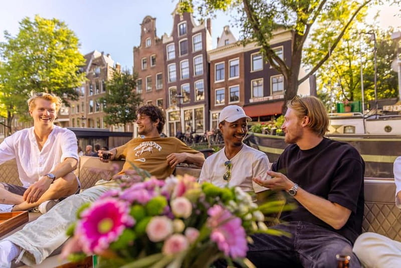 Amsterdam: Luxury Canal Cruise with Optional Snacks & Drinks - The guiding style and onboard atmosphere