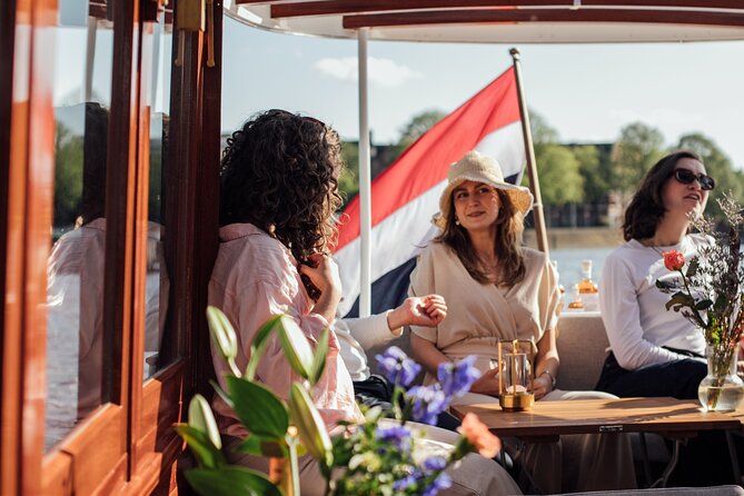 Amsterdam: Luxury Saloon Boat Cruise with Cocktails & Waffle - Central Station, the Kolksluis, and Amsterdam’s working waterfront