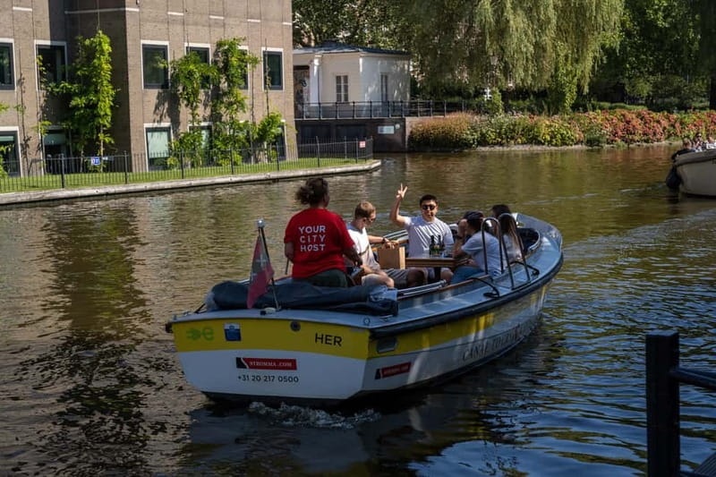 Amsterdam: Open Boat Tour of Canals with Expert Local Guide - Passing the Rijksmuseum without losing your afternoon