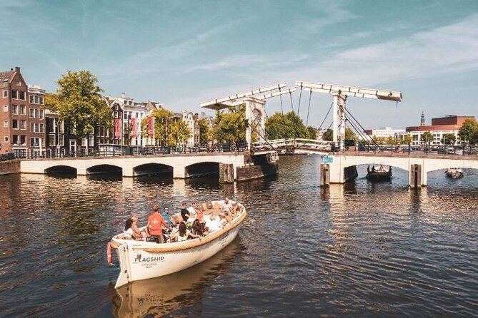 Amsterdam Private Boat Trip with Pizza and Unlimited Drinks - Bridges, flower stalls, and the Amstel