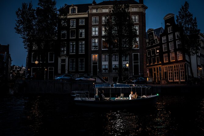 Amsterdam: Private Romantic Evening Canal Cruise + Bubbles/Snacks - Torensluis, the smallest house, and the shortest canal