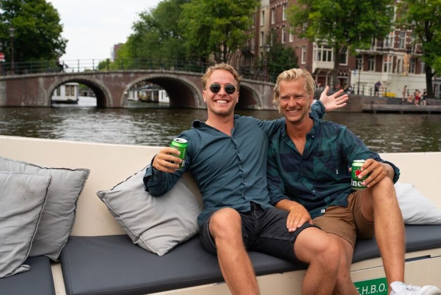 Amsterdam: Red-Light District Pub Crawl and Booze Boat Tour - A canal cruise before the night gets loud