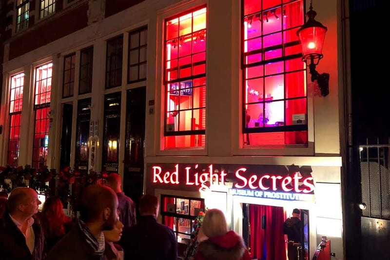 Amsterdam: Red Light District Tour - Dam Square and the reasons behind Amsterdam’s tolerance