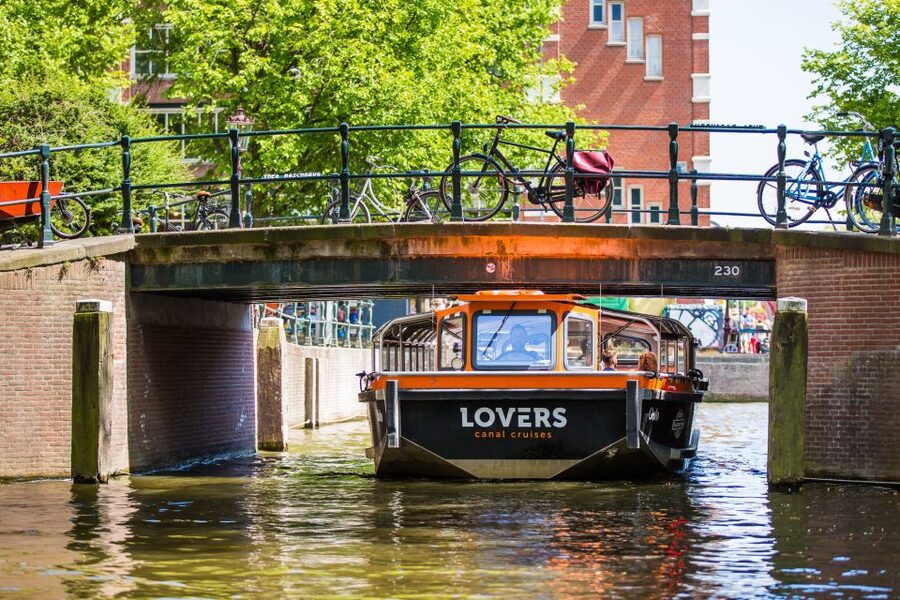 Amsterdam: Semi-Open Canal Boat Cruise - Audio guides, captains, and the best seat