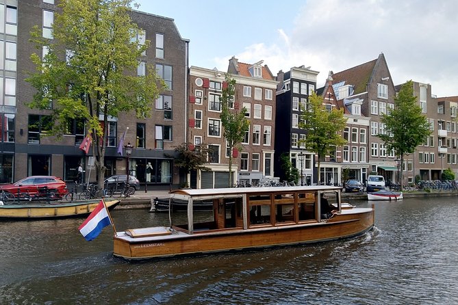 Amsterdam small-group canal cruise in 1920s saloon boat - Following the main canal ring