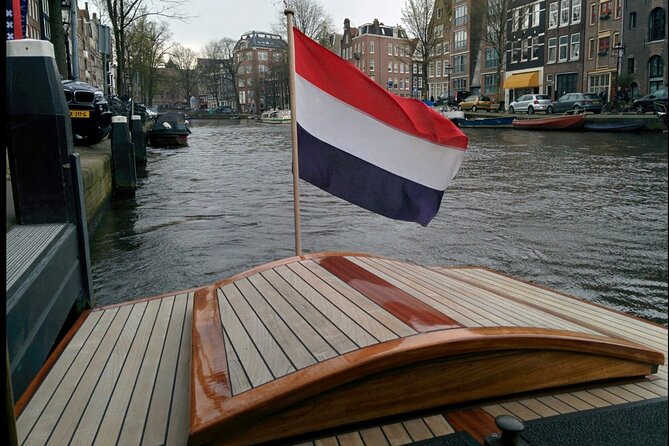 Amsterdam small-group canal cruise in 1920s saloon boat - Comfort in rain and cool weather