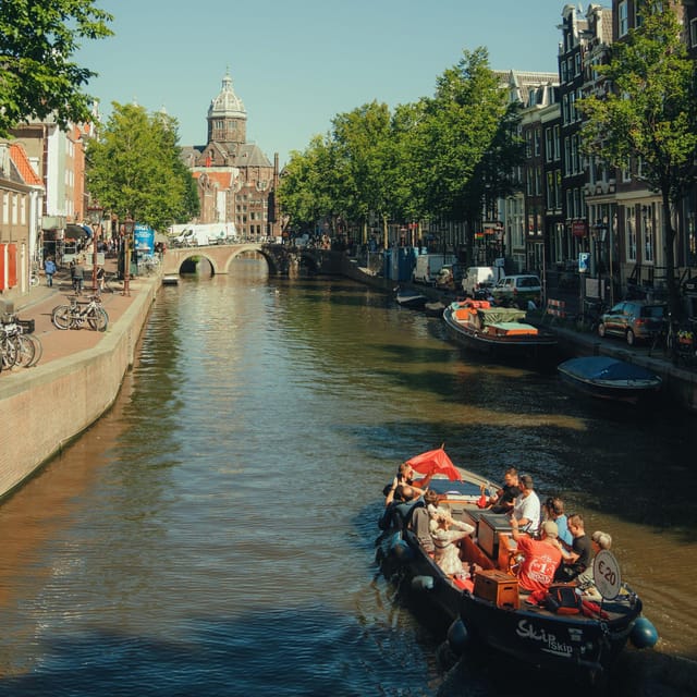 COZY AND FUN CANAL TOUR: A UNIQUE JOURNEY THROUGH AMSTERDAM - Stopera, Herengracht, and Amsterdam’s grand canal ring