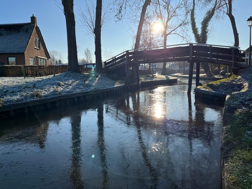 From Amsterdam: Giethoorn Small Group Tour with Boat Ride - Walking across bridges and around the village