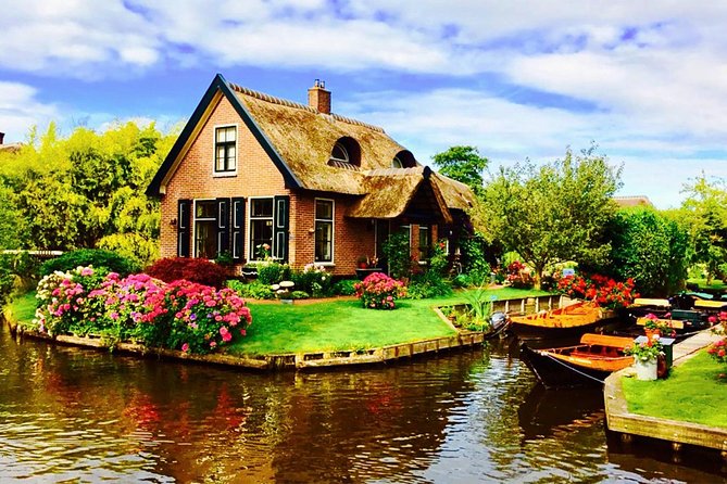 From Amsterdam: Zaanse Schans, Volendam, Giethoorn with Boat Tour - Zaanse Schans: windmills, clogs, and Dutch cheese