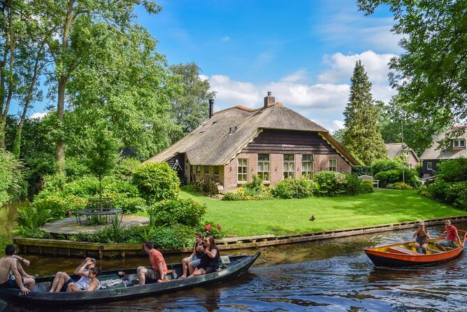 Giethoorn Day Trip from Amsterdam With Cruise and Cheeseplatter - Leaving Amsterdam at De Ruijterkade 105