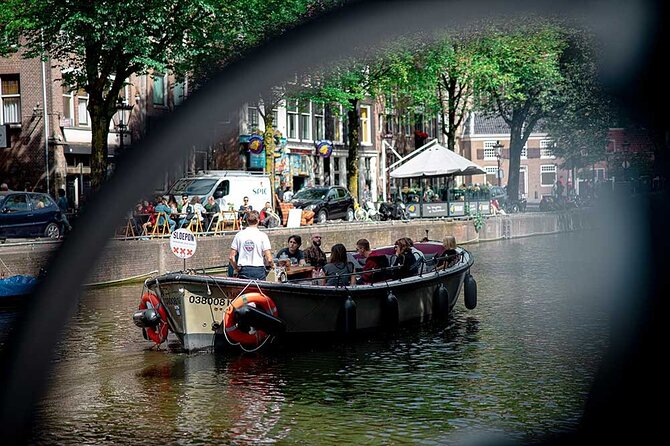 Guided Amsterdam Canal Cruise – Snacks & Drinks on board(1 Hour) - The bridges and leaning houses everyone wants to photograph