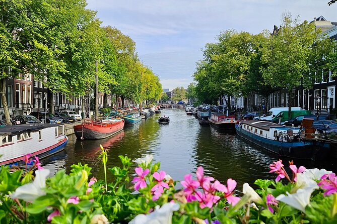 Private 90 Minute Amsterdam Canal Belt Exploration Cruise - Munt Tower and the floating flower market